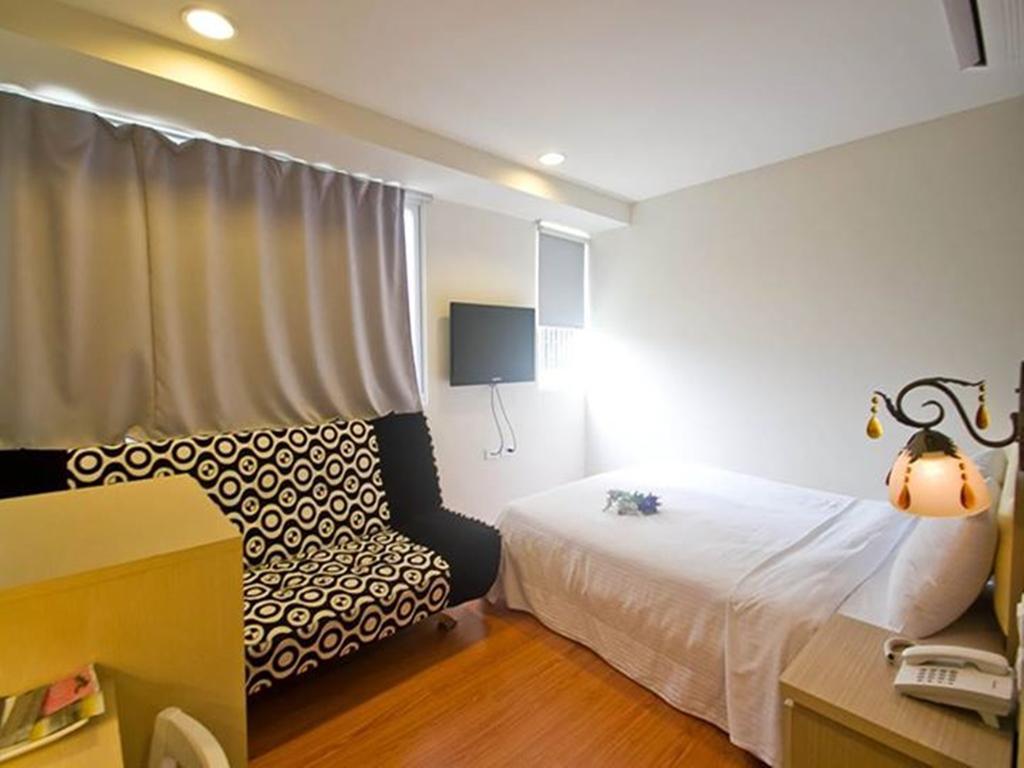 Green Park Commercial Hotel Tchaj-nan Pokoj fotografie